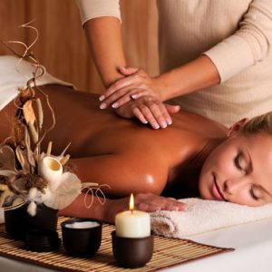 professional masseur doing massage of female back